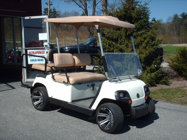 A golf car available from North Country Golf Car