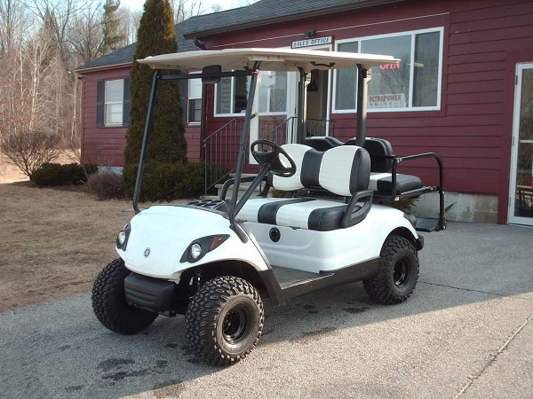 A golf car available from North Country Golf Car